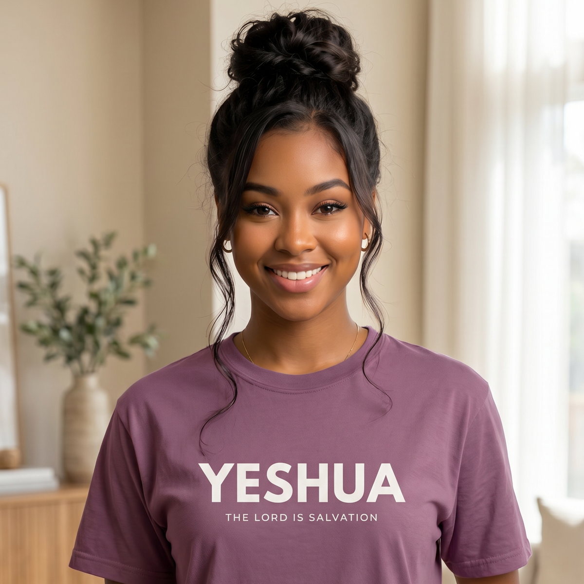 Smiling woman wearing a berry purple Yeshua Christian T-shirt with “The Lord Is Salvation” printed in white.