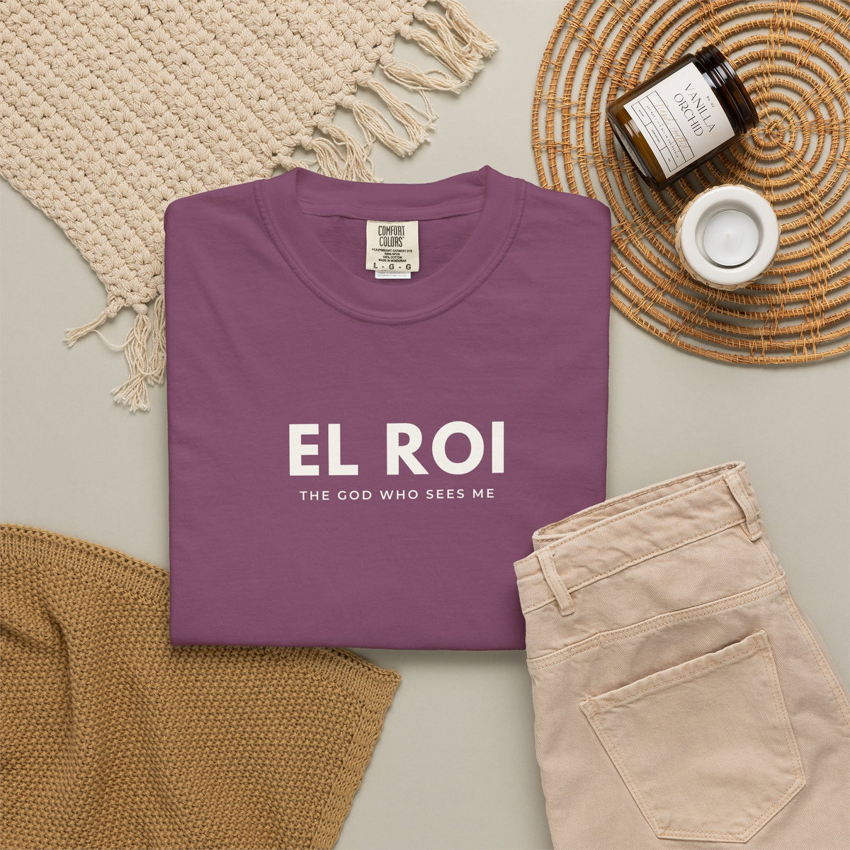 Berry El Roi Christian T-shirt with “The God Who Sees Me” typography, styled in a neutral flat lay.