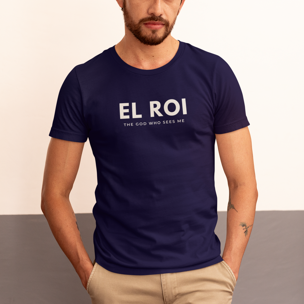 Man wearing a true navy El Roi Christian T-shirt with “The God Who Sees Me” printed in white.